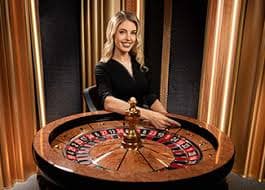 Slot game interface showing Aviator and Sweet Bonanza titles